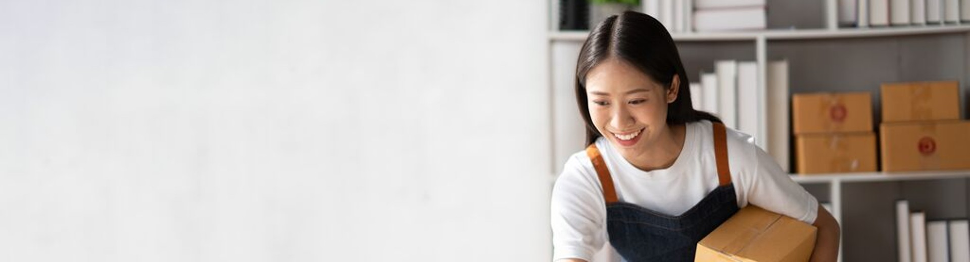 GLS private customer holding two parcels waiting for GLS printable labels