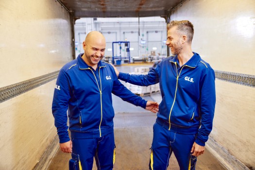 Two employees laughing