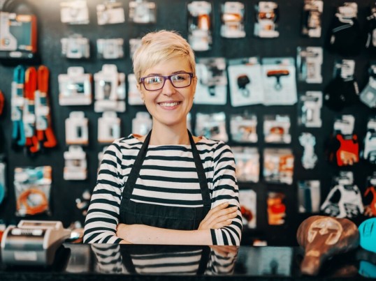 GLS business customer standing in front of her store