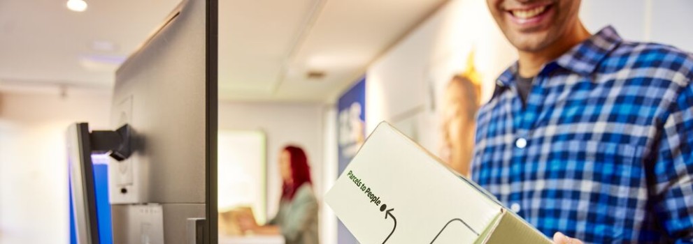 Man coming out from a GLS parcel shop